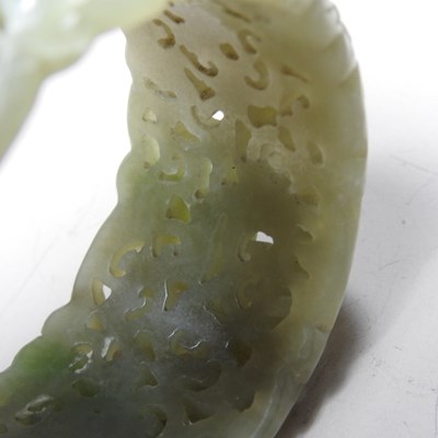 Lot 42 - A Chinese carved celadon jade coloured stone...