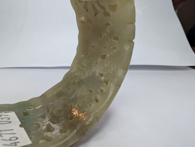Lot 42 - A Chinese carved celadon jade coloured stone...