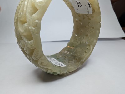 Lot 42 - A Chinese carved celadon jade coloured stone...