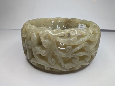 Lot 42 - A Chinese carved celadon jade coloured stone...