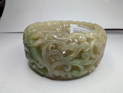 Lot 42 - A Chinese carved celadon jade coloured stone...