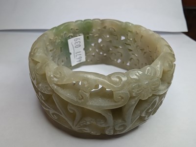 Lot 42 - A Chinese carved celadon jade coloured stone...