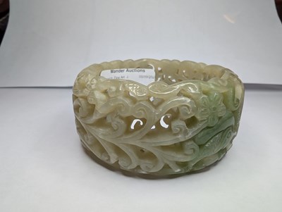 Lot 42 - A Chinese carved celadon jade coloured stone...