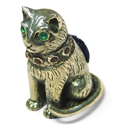 Lot 438 - A sterling silver pin cushion, in the form of...