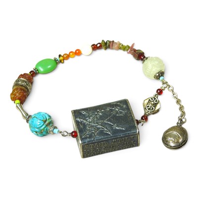 Lot 392 - A Tibetan gau multi-coloured hardstone prayer...