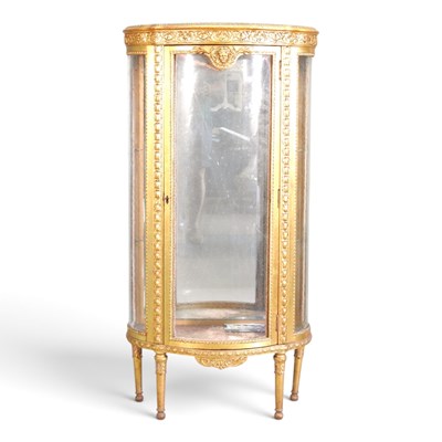 Lot 395 - A mid 20th century French gilt vitrine, of bow...