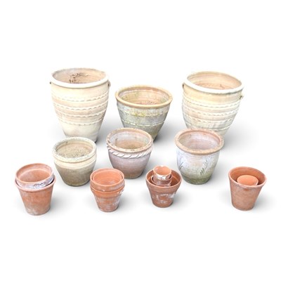 Lot 595 - A collection of terracotta garden pots,...