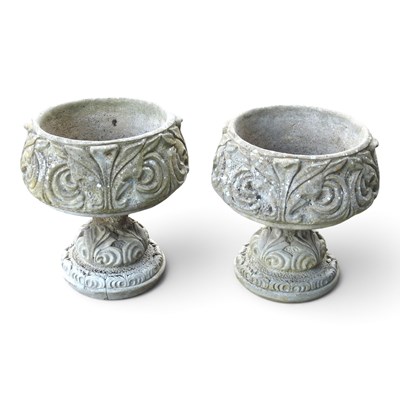 Lot 639 - A pair of cast stone pedestal garden urns,...