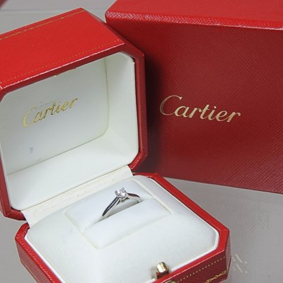 Lot 90 - A Cartier platinum solitaire diamond ring,...