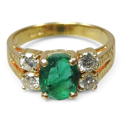 Lot 171 - An 18 carat gold emerald and diamond ring, the...
