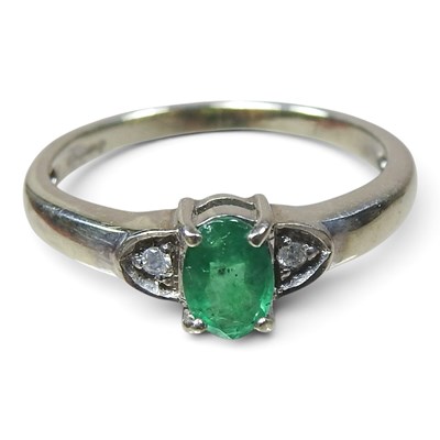 Lot 193 - A 9 carat gold emerald and diamond three stone...