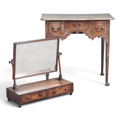 Lot 784 - An 18th century oak lowboy, containing three...