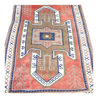Lot 783 - A Turkish woollen rug, with a large central...