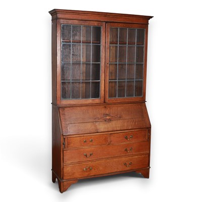 Lot 713 - A 1920s oak bureau bookcase