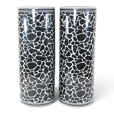 Lot 529 - A pair of black and white porcelain stick...