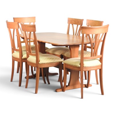 Lot 291 - A modern Ercol light elm refectory dining...