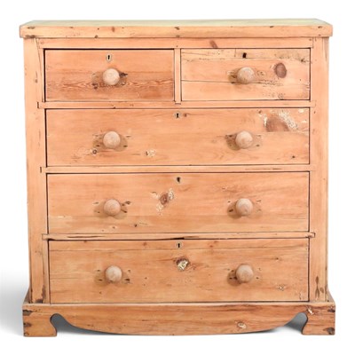 Lot 165 - A rustic pine chest of drawers, on a shaped base