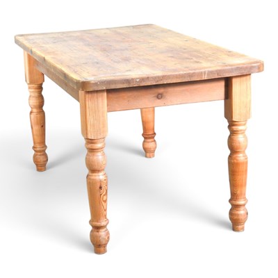 Lot 254 - A modern pine dining table, on turned legs