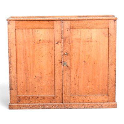 Lot 524 - An antique pine side cabinet, on a plinth base