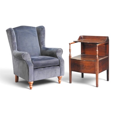Lot 424 - A modern blue upholstered wing armchair,...
