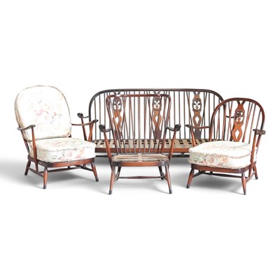 Lot 326 - A 1970s dark Ercol sofa, together with three...