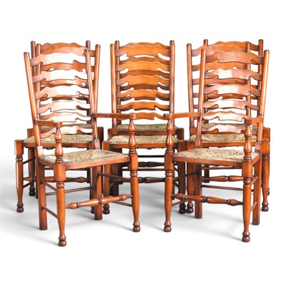 Lot 519 - A set of eight ladder back rush seated dining...