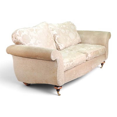 Lot 289 - A modern cream upholstered sofa, with floral...