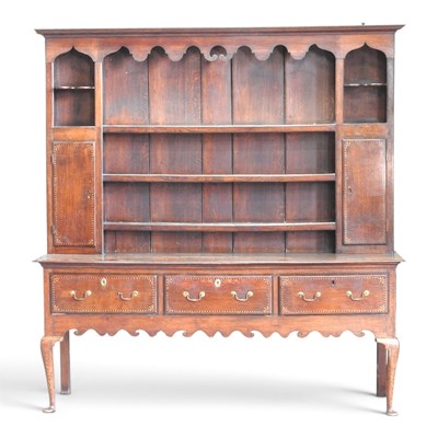 Lot 110 - An 18th century oak dresser, with a boarded...