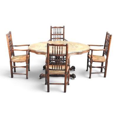 Lot 548 - A set of four rush seated spindle back...