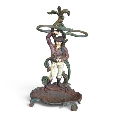 Lot 120 - A painted cast iron figural stickstand, 47cm high