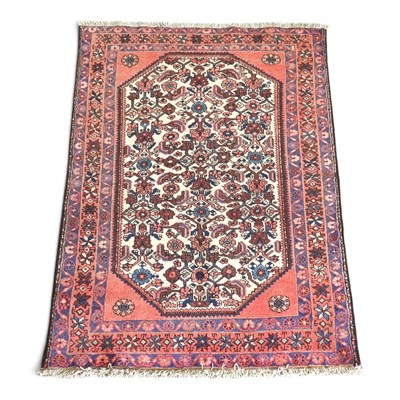 Lot 499 - A Persian malayer rug, with floral designs on...