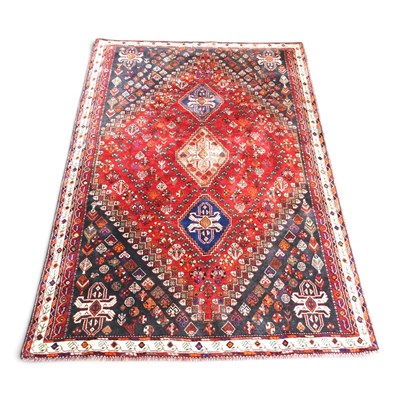 Lot 274 - A Persian qashgai carpet, with central...