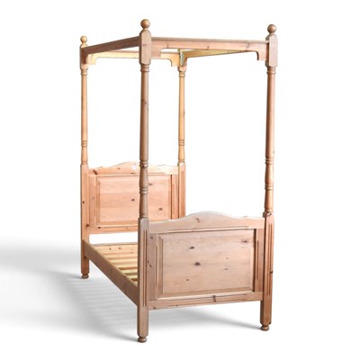 Lot 330 - A modern pine four poster pine bedstead, with...