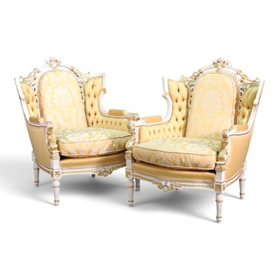 Lot 102 - A pair of ornate French style white painted...