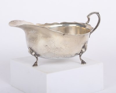 Lot 69 - A silver helmet shaped sauce boat, Birmingham...