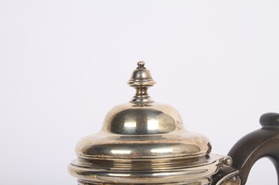 Lot 6 - A George V silver hot water pot, having a...