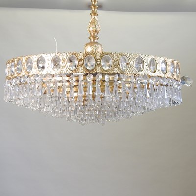 Lot 34 - A gold painted metal and cut glass chandelier