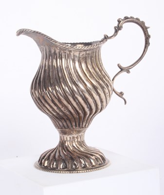 Lot 56 - A wrythen silver cream jug, London 1768, 124g