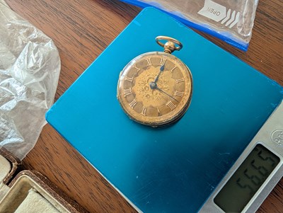 Lot 3 - An 18 carat gold pocket watch, the ornate dial...