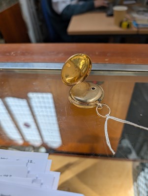 Lot 3 - An 18 carat gold pocket watch, the ornate dial...