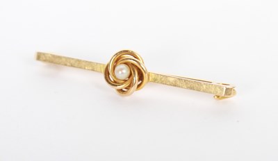 Lot 58 - A 15 carat gold pearl ball of wool bar brooch,...