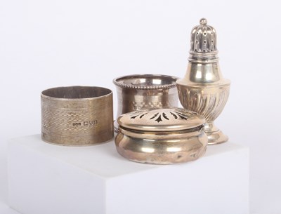 Lot 82 - A collection of mixed silver to include napkin...