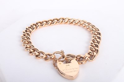 Lot 11 - A 9 carat gold curb link bracelet, with heart...