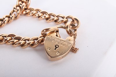 Lot 11 - A 9 carat gold curb link bracelet, with heart...
