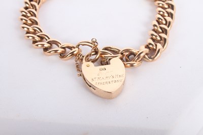 Lot 11 - A 9 carat gold curb link bracelet, with heart...