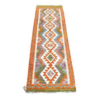 Lot 186 - A Persian kilim runner, with a row of hooked...