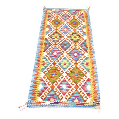 Lot 333 - A Persian kilim runner, with rows of hooked...