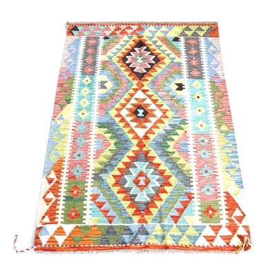 Lot 300 - A Persian kilim rug, with a row of central...