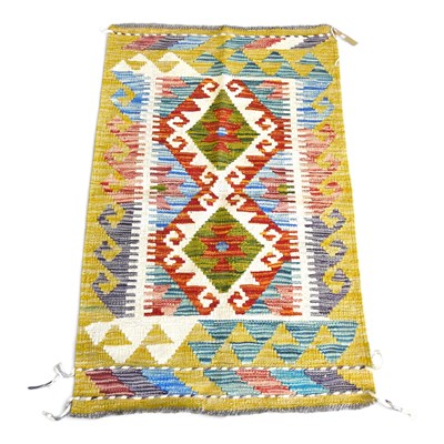 Lot 305 - A Persian kilim rug, with two central diamonds,...