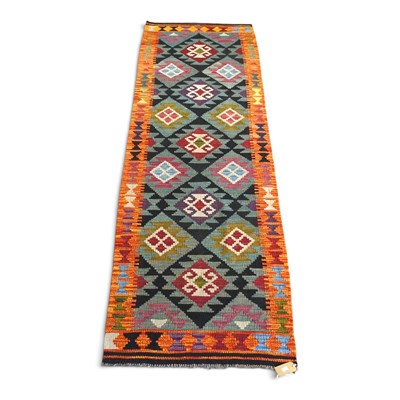 Lot 167 - A Persian kilim runner, with rows of hooked...